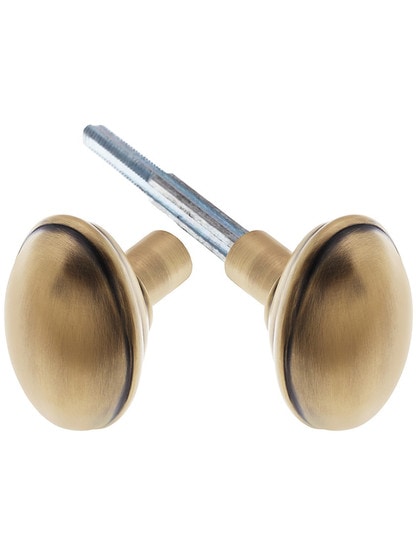 Pair of Banded Oval Door Knobs In Solid Brass Antique Brass.